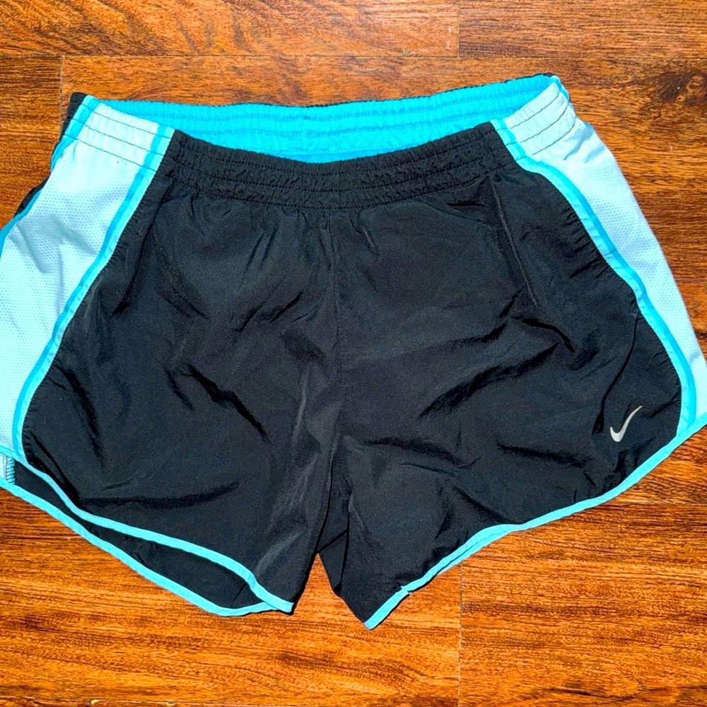 Women's size medium ￼black and blue Nike shorts
